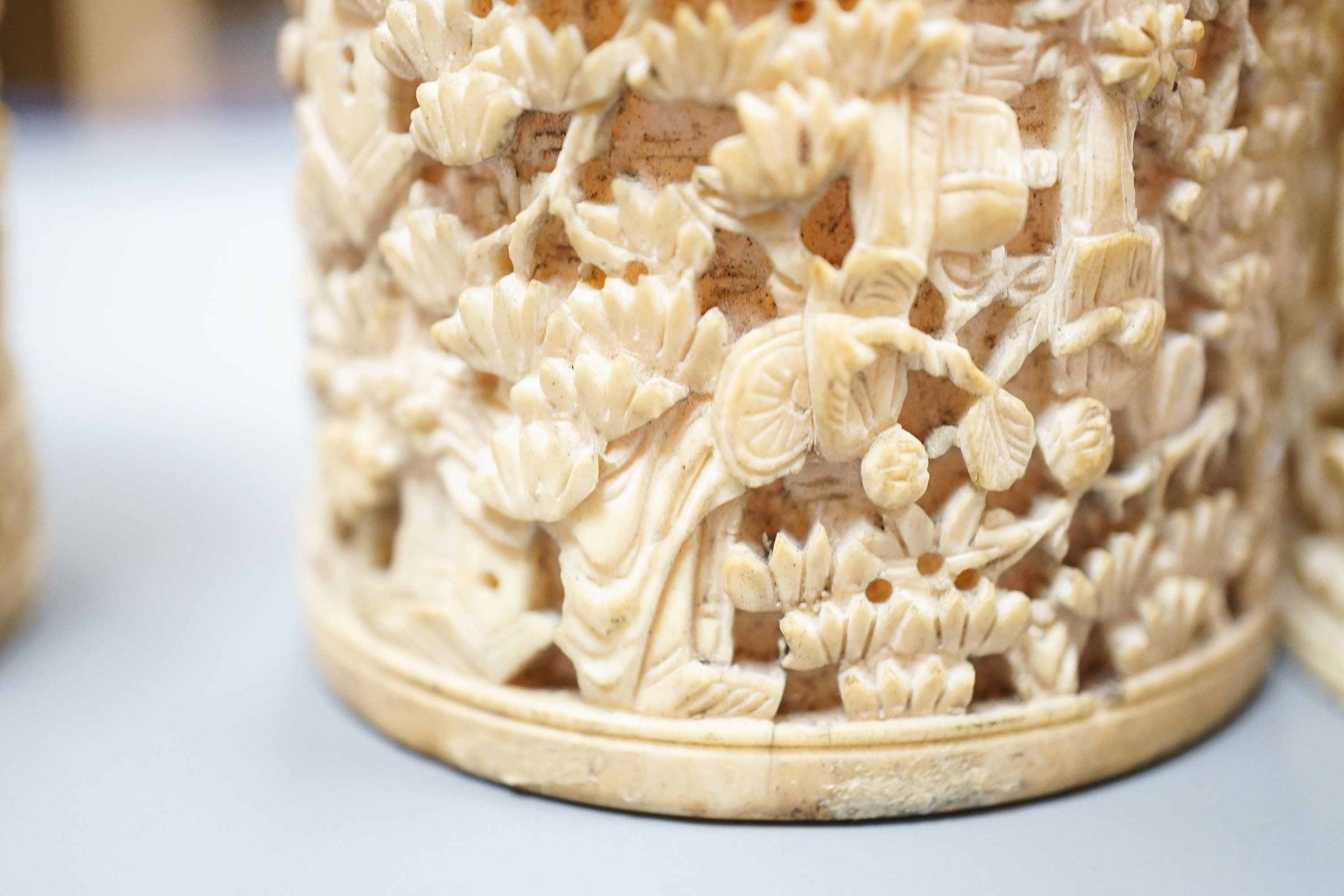 A pair of Chinese carved ivory pots and a Chinese ivory circular box and cover, 19th century